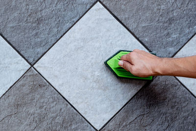 High angle view of man working on floor at home