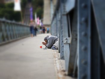 Side view of man on footpath