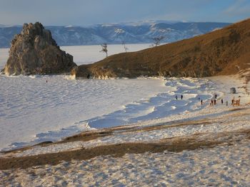 Scenic view of frozen lake on olkhon island