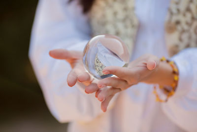 Close-up of woman holding hands