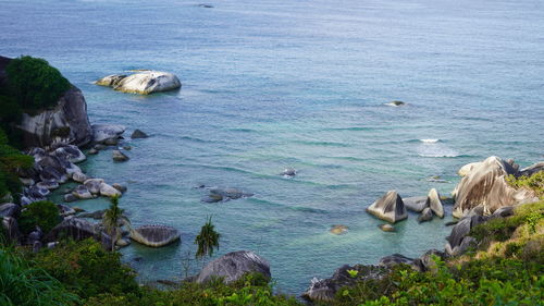 High angle view of rocks at sea shore