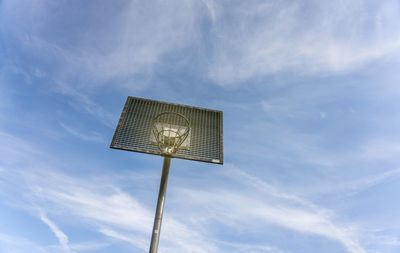 Low angle view of basketball hoop against sky