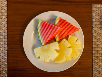 High angle view of fruits in plate on table