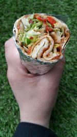 Cropped of hand holding food