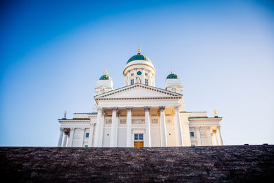 Low angle view of building against clear blue sky