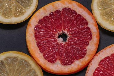 Close-up of citrus fruit slices on table