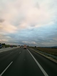 Highway against sky during sunset