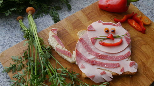 High angle view of meat on cutting board