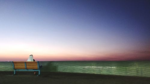 Scenic view of sea against clear sky during sunset