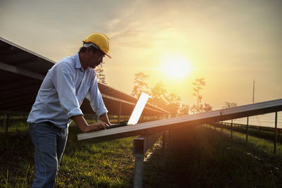 Rear view of man working at construction site