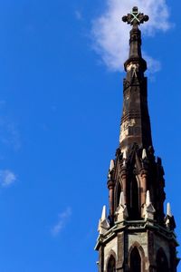 Low angle view of built structure against blue sky