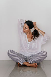 Young girl sitting on the floor