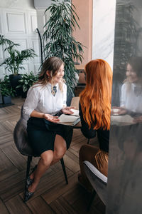 Women sitting on table