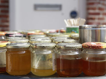 Close-up of beer in glass jar on table