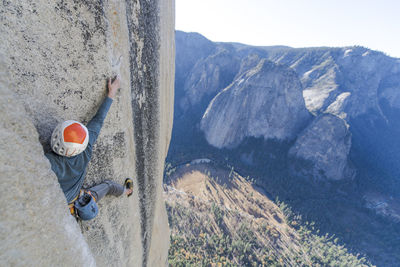 Rock climber crack climbing on the nose, el capitan in yosemite