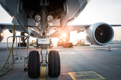 Airplane on runway during sunset