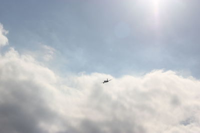 Low angle view of airplane flying in sky