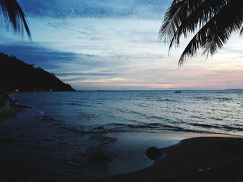 Scenic view of sea against sky at sunset