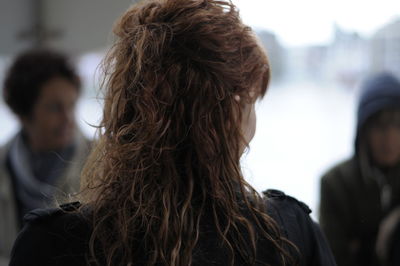 Rear view of woman with wavy hair