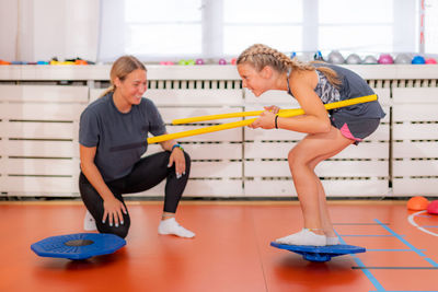 Balance exercises for children, using balancing disks