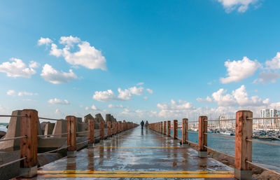 Pier over sea against sky