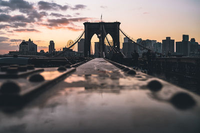 View of suspension bridge against cloudy sky