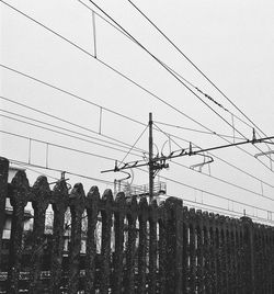 Low angle view of cables against sky