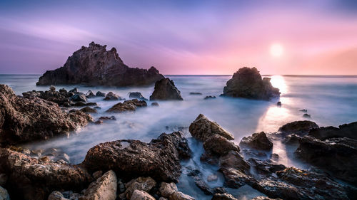 Scenic view of sea against sky during sunset