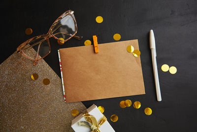 Christmas mock up of crafting envelope, stationery card, wrapping paper and holidays glittering. 