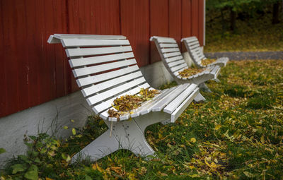 High angle view of empty chairs and table in yard