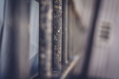 Directly below view of weathered metallic ladder