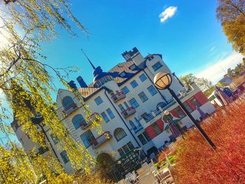 Low angle view of buildings against blue sky