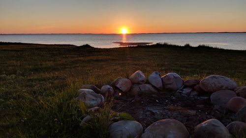 Scenic view of sea against sky during sunset