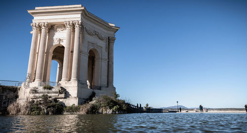 Low angle view of historical building against clear sky