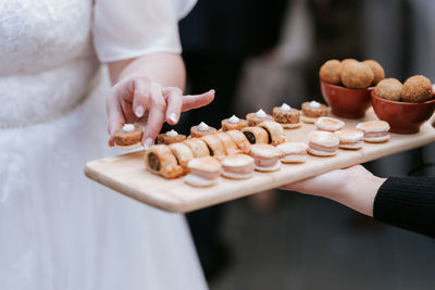 Midsection of man canopies wedding