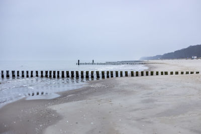 Scenic view of beach against clear sky