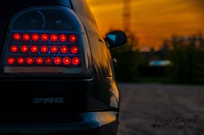 Close-up of illuminated text on car