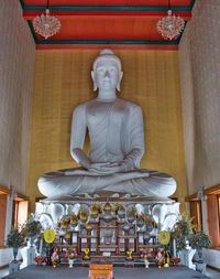 Statue in temple outside building