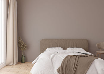 Empty brown wall in modern bedroom. mock up interior in scandinavian, boho style. free, copy space 