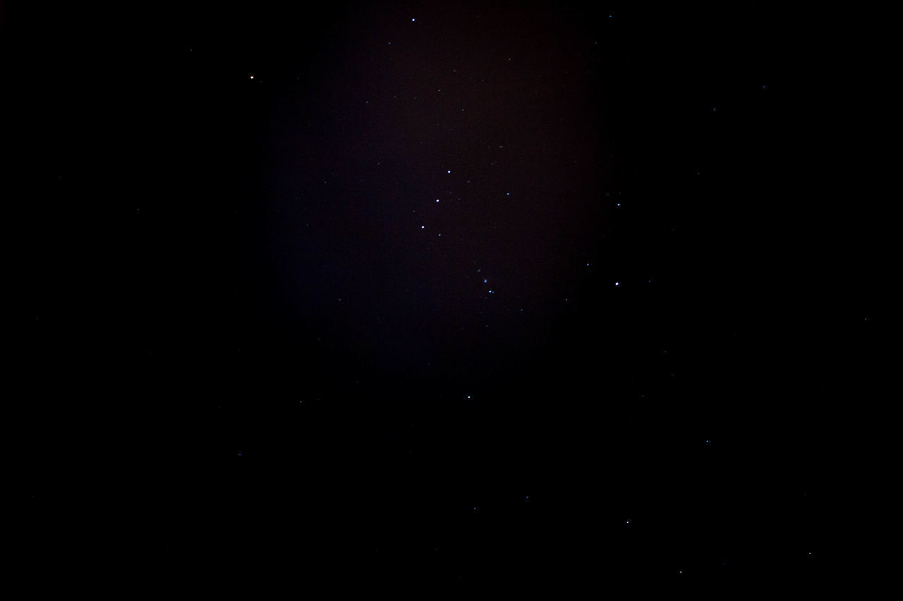 LOW ANGLE VIEW OF STAR FIELD AGAINST SKY AT NIGHT