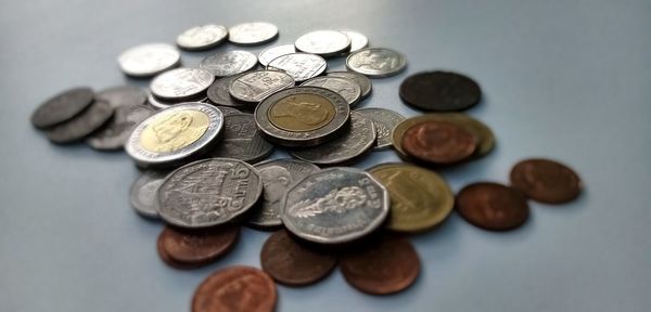 High angle view of coins on table