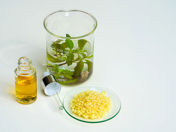 Glass of juice against white background