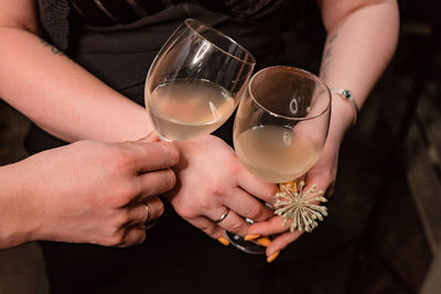 Midsection of woman holding drink