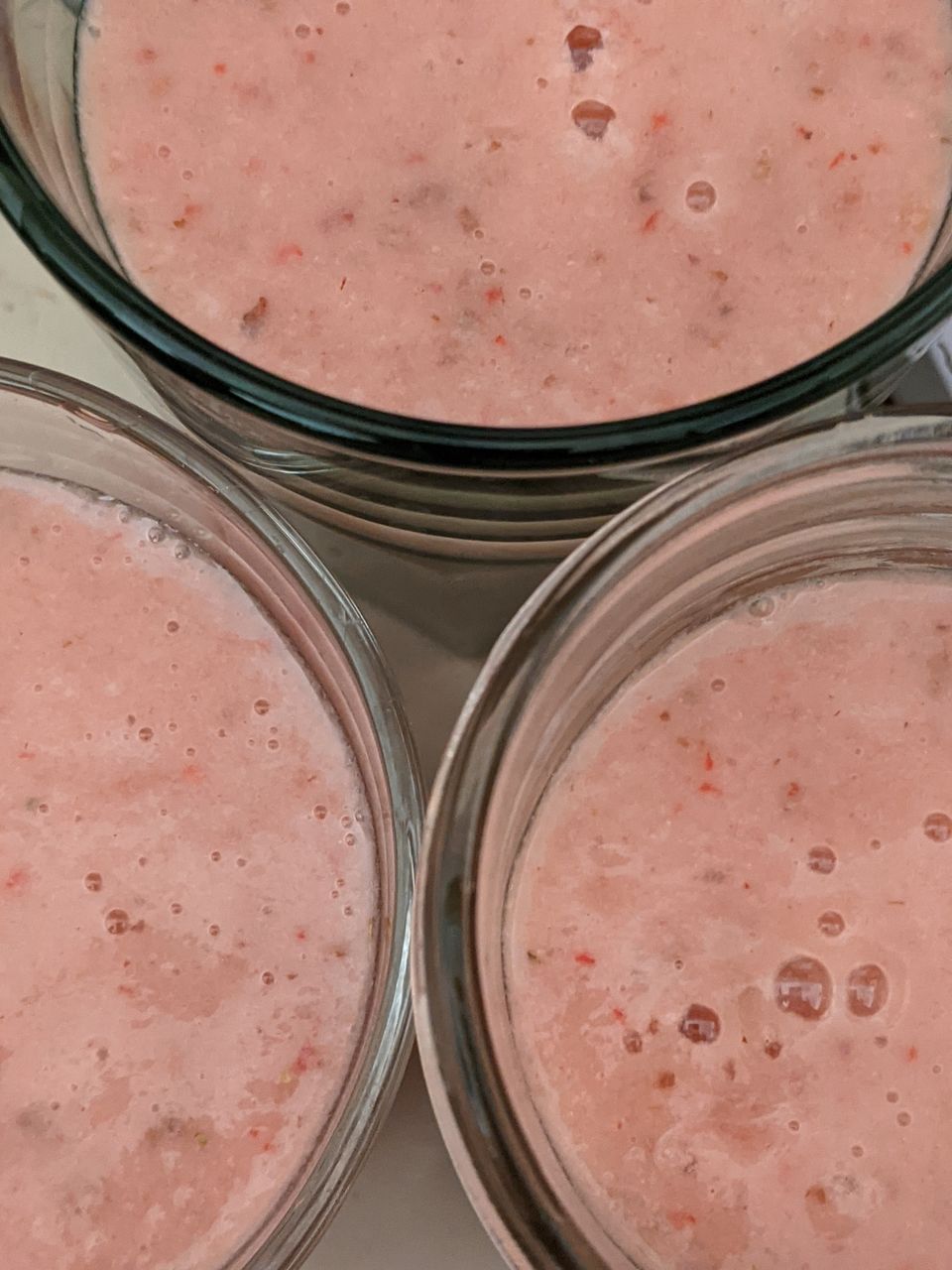 food and drink, food, indoors, pink, smoothie, produce, container, dessert, household equipment, no people, close-up, still life, healthy eating, freshness, glass, wellbeing, high angle view, drink, jar, lip, variation, fruit, drinking glass, table