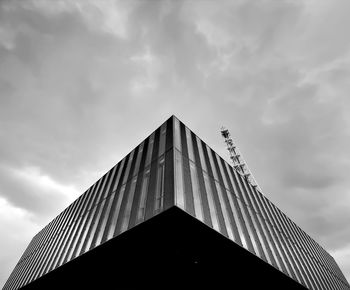 Low angle view of building against cloudy sky