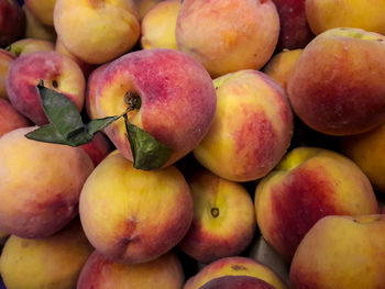 Shot of peaches for sale at market stall