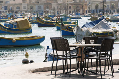 Boats moored at harbor