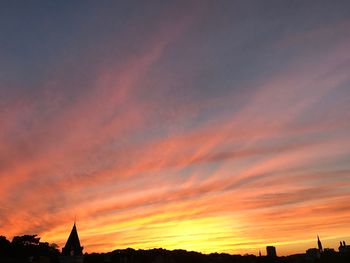 Low angle view of dramatic sky during sunset