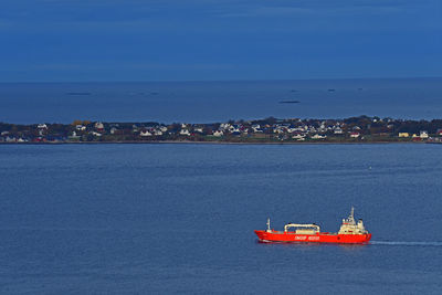 Scenic view of sea against blue sky