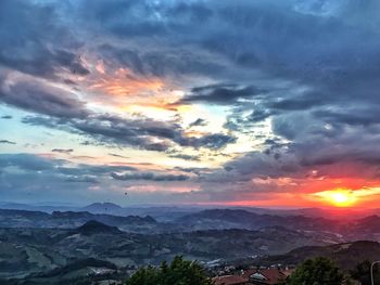 Scenic view of mountains against sky at sunset